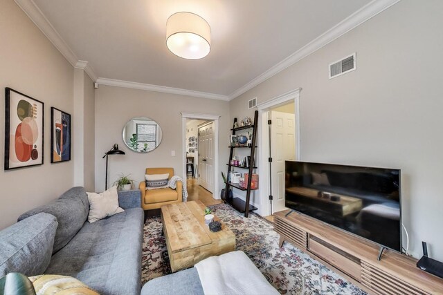 2336 W Roscoe St Unit 3R, Chicago, IL 60618 - living room featuring crown molding and wood finished floors