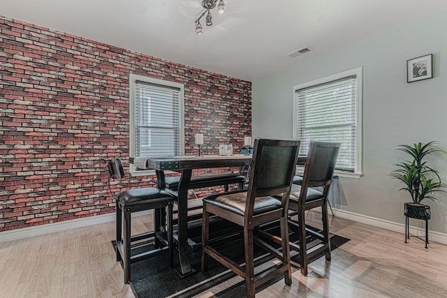2315 Gilboa Ave, Zion, IL 60099 - dining area featuring wood finished floors and brick wall