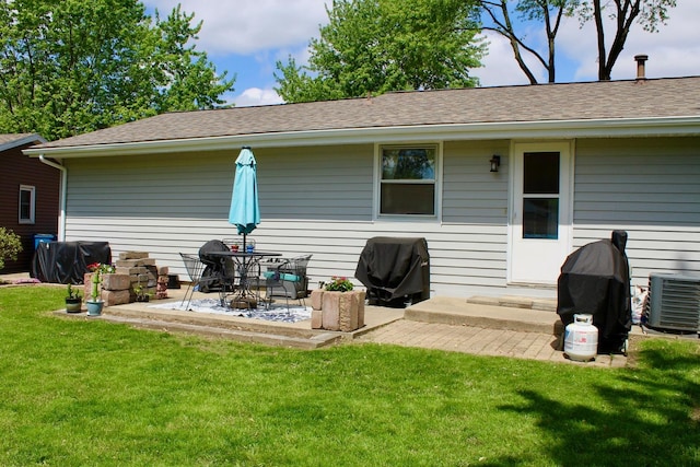 818 Edwin Dr, Bourbonnais, IL 60914 - rear view of property featuring a yard, a patio, cooling unit, and a shingled roof