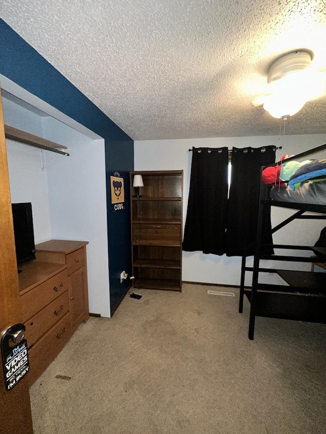 818 Edwin Dr, Bourbonnais, IL 60914 - bedroom with a textured ceiling and light colored carpet