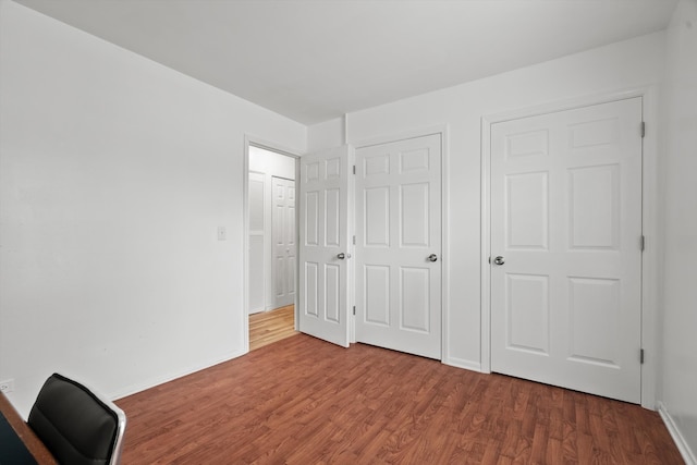 366 Meadow Ct Unit 366, Vernon Hills, IL 60061 - unfurnished bedroom featuring wood finished floors, baseboards, and an office area