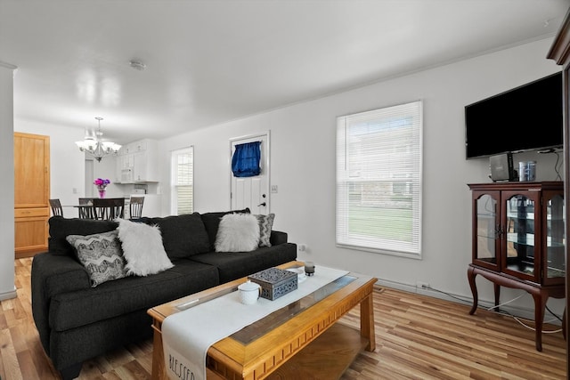 366 Meadow Ct Unit 366, Vernon Hills, IL 60061 - living room featuring a chandelier and light wood-style floors