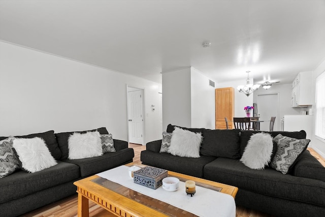 366 Meadow Ct Unit 366, Vernon Hills, IL 60061 - living area with a chandelier and light wood-style floors