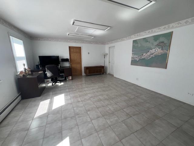 4234 Prescott Ave, Lyons, IL 60534 - office area featuring attic access and a baseboard radiator