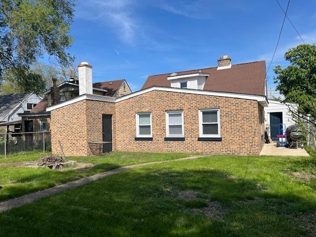 4234 Prescott Ave, Lyons, IL 60534 - back of house with brick siding, a chimney, and a patio