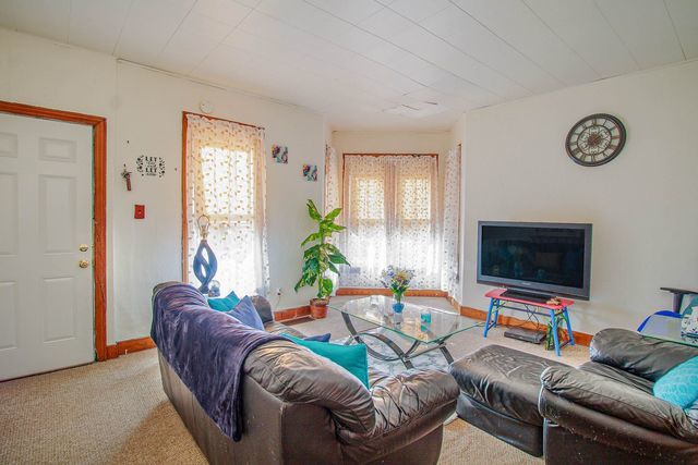 2460 Indiana Ave, Lansing, IL 60438 - carpeted living room with baseboards