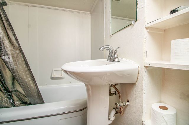 2460 Indiana Ave, Lansing, IL 60438 - full bath featuring shower / bath combo with shower curtain