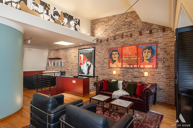 11333 S Langley Ave, Chicago, IL 60628 - living area featuring brick wall, wood finished floors, and high vaulted ceiling