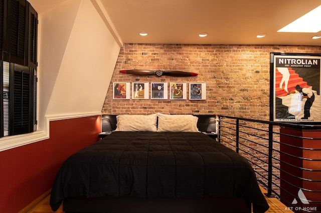 11333 S Langley Ave, Chicago, IL 60628 - bedroom featuring recessed lighting, brick wall, and wood finished floors
