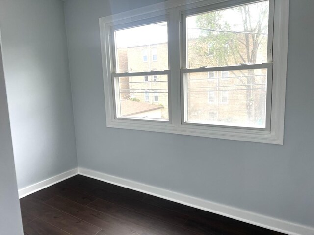 9109 Lamon Ave Unit 2N, Skokie, IL 60077 - unfurnished room featuring baseboards and dark wood finished floors