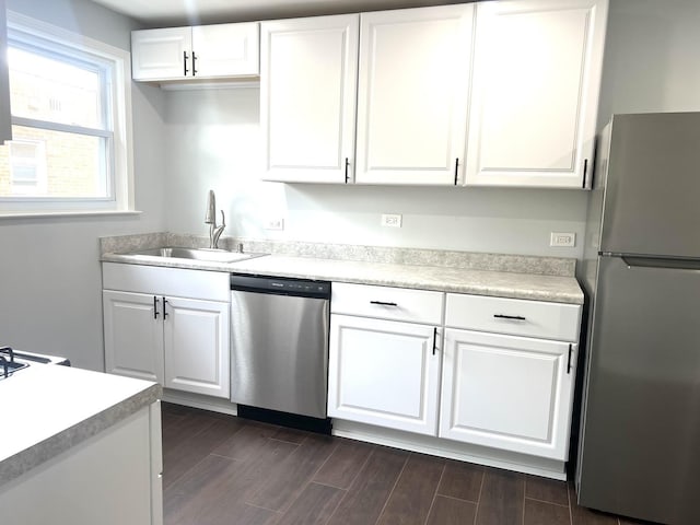 9109 Lamon Ave Unit 2N, Skokie, IL 60077 - kitchen with appliances with stainless steel finishes, a sink, and white cabinetry