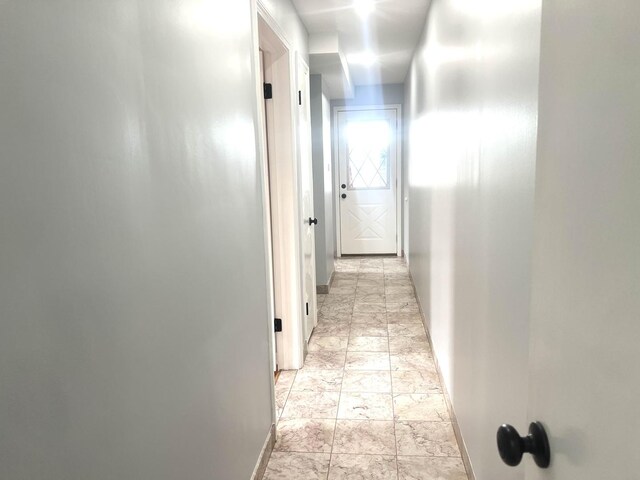 9109 Lamon Ave Unit 2N, Skokie, IL 60077 - hallway featuring baseboards and light marble finish floors