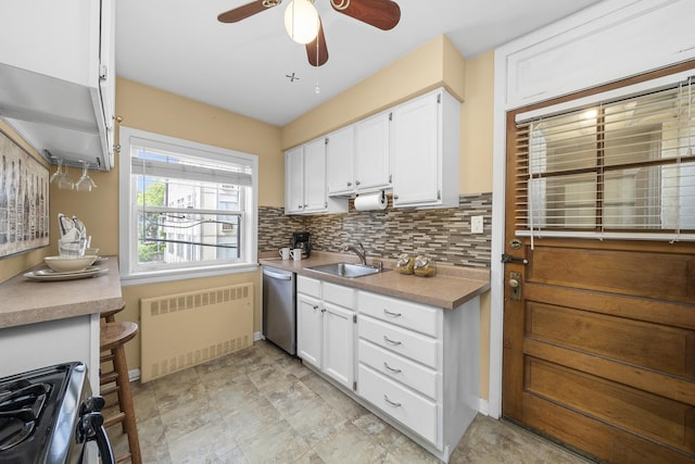 213 N Marion St Unit 2D, Oak Park, IL 60302 - kitchen featuring radiator heating unit, a sink, stainless steel dishwasher, stove, and white cabinets