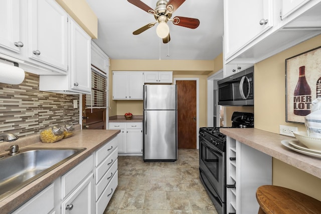 213 N Marion St Unit 2D, Oak Park, IL 60302 - kitchen featuring appliances with stainless steel finishes, a sink, ceiling fan, backsplash, and white cabinets