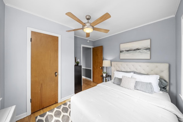 213 N Marion St Unit 2D, Oak Park, IL 60302 - bedroom featuring wood finished floors, crown molding, baseboards, and a ceiling fan