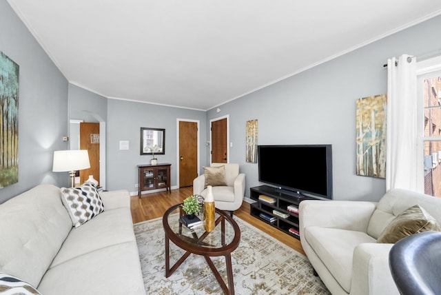213 N Marion St Unit 2D, Oak Park, IL 60302 - living area with arched walkways, light wood-style flooring, and crown molding