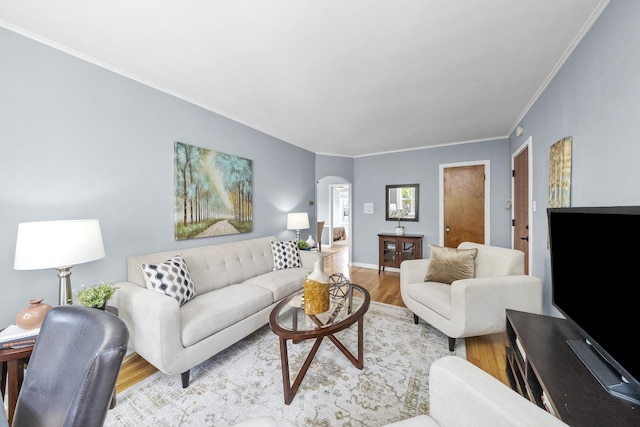 213 N Marion St Unit 2D, Oak Park, IL 60302 - living room with arched walkways, wood finished floors, ornamental molding, and baseboards