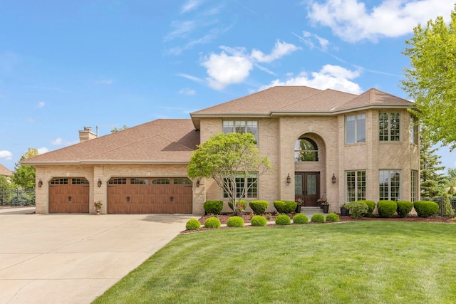 13187 Briar Patch Ln, Lemont, IL 60439 - view of front facade featuring french doors, a garage, driveway, a front yard, and brick siding