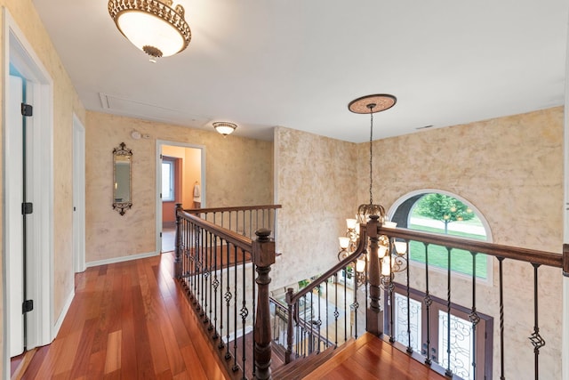 13187 Briar Patch Ln, Lemont, IL 60439 - hallway with attic access, an upstairs landing, wood-type flooring, baseboards, and a chandelier