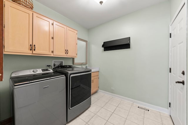 13187 Briar Patch Ln, Lemont, IL 60439 - laundry area featuring cabinet space, washing machine and clothes dryer, baseboards, and light tile patterned flooring