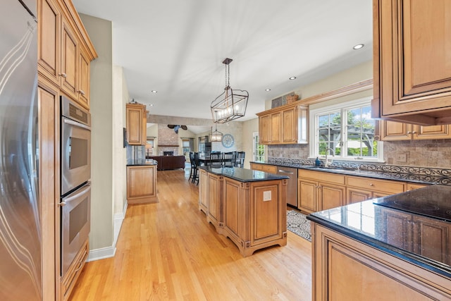 13187 Briar Patch Ln, Lemont, IL 60439 - kitchen with stainless steel appliances, light wood finished floors, decorative backsplash, a center island, and open floor plan