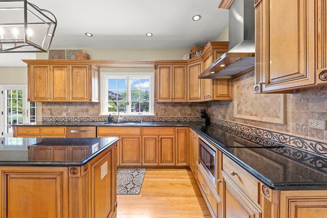 13187 Briar Patch Ln, Lemont, IL 60439 - kitchen featuring wall chimney range hood, a sink, brown cabinetry, light wood-style floors, and recessed lighting