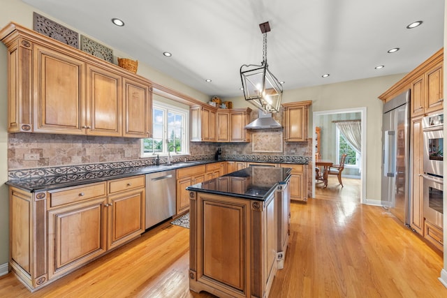 13187 Briar Patch Ln, Lemont, IL 60439 - kitchen with appliances with stainless steel finishes, light wood-style flooring, a kitchen island, tasteful backsplash, and recessed lighting