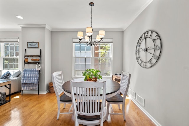 210 Station Park Cir, Grayslake, IL 60030 - dining space with light wood-style flooring, a chandelier, ornamental molding, and baseboards