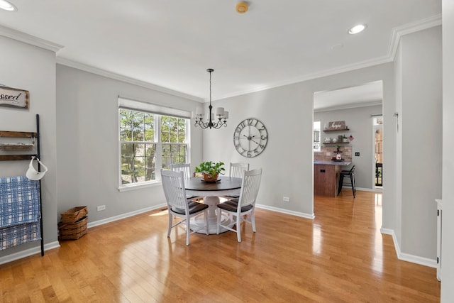 210 Station Park Cir, Grayslake, IL 60030 - dining room featuring light wood-type flooring, a chandelier, baseboards, recessed lighting, and ornamental molding