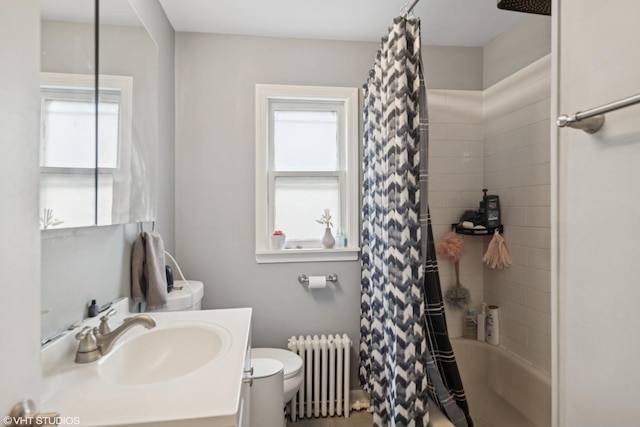bathroom with radiator, plenty of natural light, toilet, and shower / bath combo