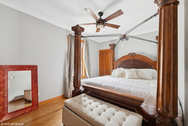 bedroom with crown molding, light wood-type flooring, baseboards, and ceiling fan
