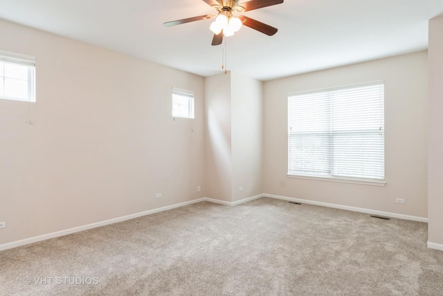1520 Mansfield Dr, Aurora, IL 60502 - carpeted empty room featuring ceiling fan and baseboards