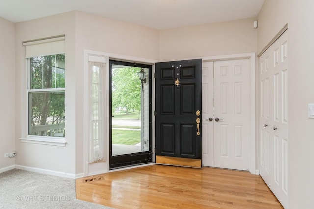 1520 Mansfield Dr, Aurora, IL 60502 - entryway featuring baseboards and wood finished floors