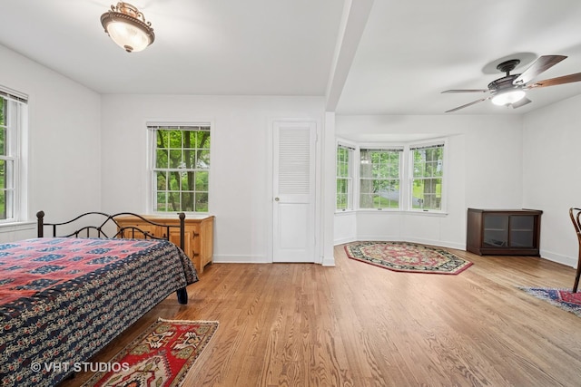 145 W Lake Shore Dr, Tower Lakes, IL 60010 - bedroom with wood finished floors, multiple windows, and baseboards