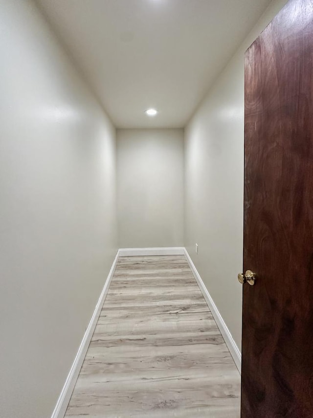 5411 S Brookstone Dr, Rochelle, IL 61068 - hallway featuring baseboards, wood finished floors, and recessed lighting