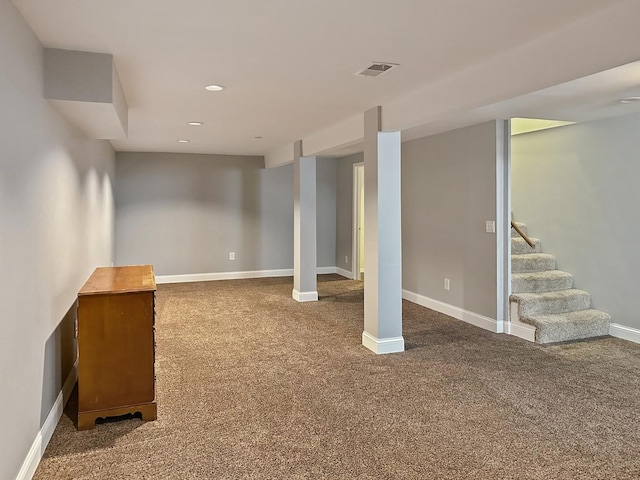 5411 S Brookstone Dr, Rochelle, IL 61068 - finished below grade area with carpet, baseboards, stairway, and recessed lighting