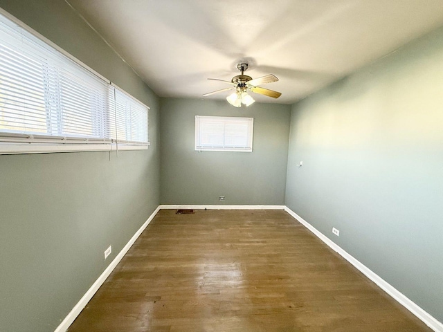 7825 S Pulaski Rd, Chicago, IL 60652 - spare room with a ceiling fan, wood finished floors, and baseboards