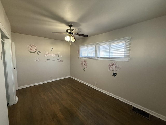 7825 S Pulaski Rd, Chicago, IL 60652 - unfurnished room with dark wood-style floors, ceiling fan, and baseboards
