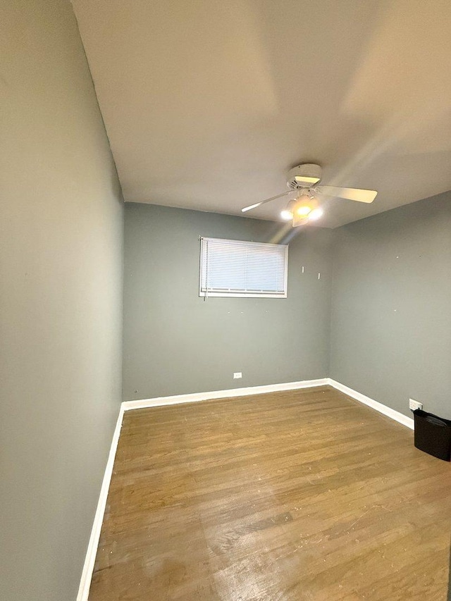 7825 S Pulaski Rd, Chicago, IL 60652 - spare room with ceiling fan, wood finished floors, and baseboards