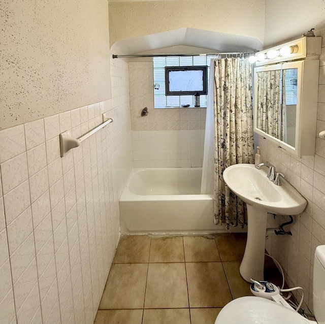 7825 S Pulaski Rd, Chicago, IL 60652 - full bathroom with tile walls, tile patterned flooring, toilet, shower / tub combo, and a wainscoted wall