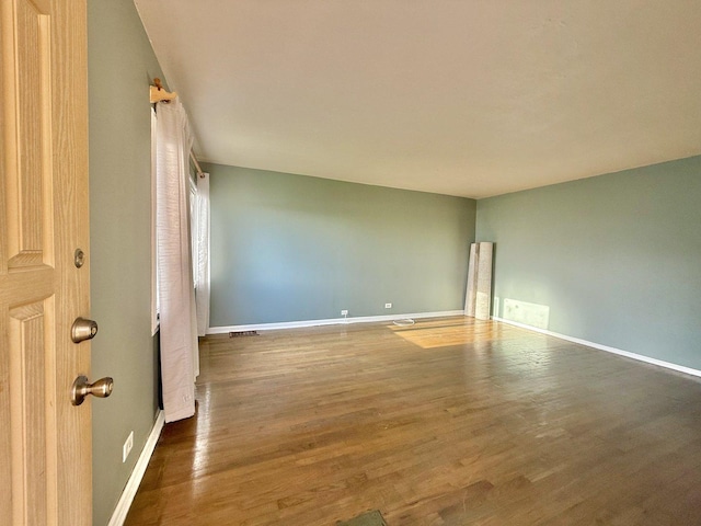 7825 S Pulaski Rd, Chicago, IL 60652 - empty room with wood finished floors and baseboards