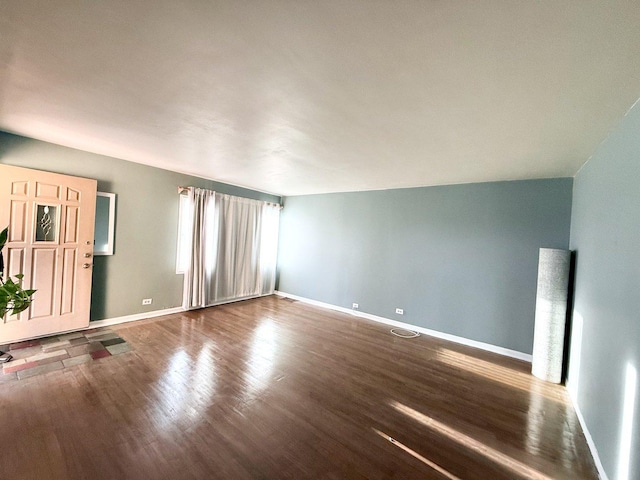 7825 S Pulaski Rd, Chicago, IL 60652 - unfurnished living room featuring wood finished floors and baseboards