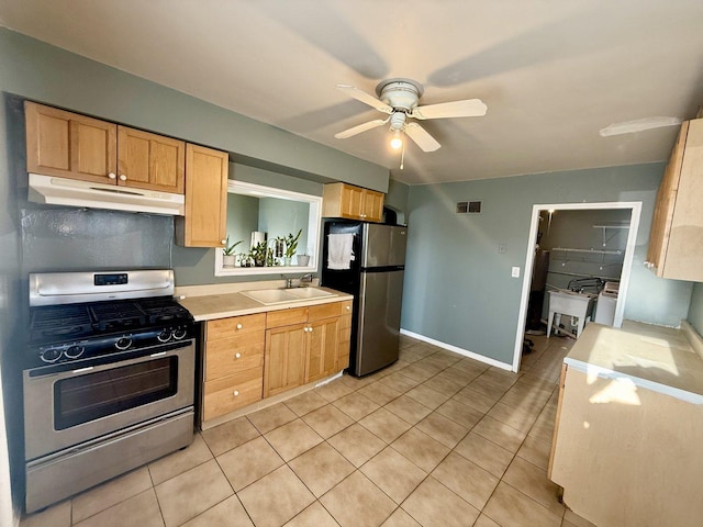 7825 S Pulaski Rd, Chicago, IL 60652 - kitchen with stainless steel appliances, a sink, under cabinet range hood, light countertops, and a ceiling fan