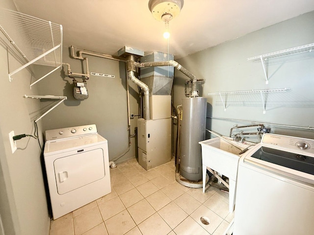 7825 S Pulaski Rd, Chicago, IL 60652 - laundry area with gas water heater, heating unit, light tile patterned floors, and washer and dryer