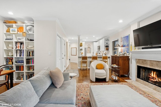 2842 N Southport Ave Unit 2, Chicago, IL 60657 - living area featuring wood finished floors, crown molding, recessed lighting, and a premium fireplace