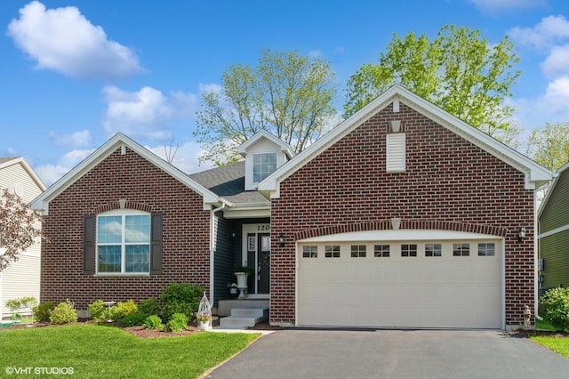 1200 Ardmoor Dr, Crystal Lake, IL 60012 - view of front facade with brick siding, asphalt driveway, a garage, and a front yard