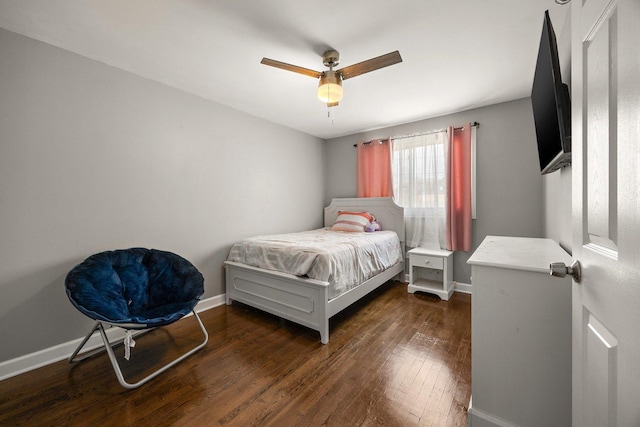 bedroom with dark wood-style flooring, baseboards, and a ceiling fan