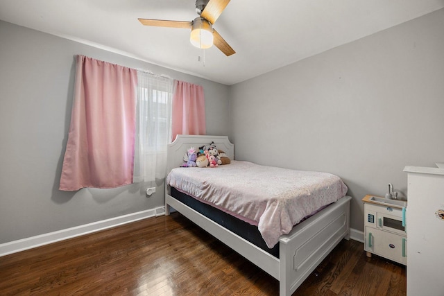 bedroom with wood finished floors, baseboards, and a ceiling fan