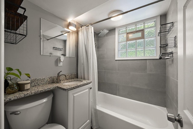 full bath with toilet, shower / tub combo with curtain, and vanity