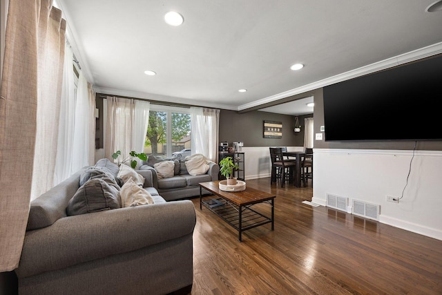 living room featuring dark wood-style floors, baseboards, recessed lighting, and ornamental molding